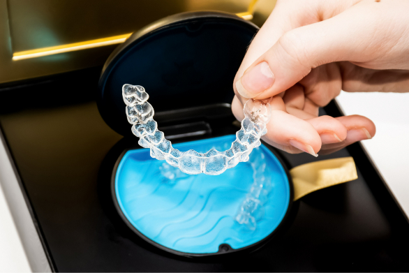 Clear aligners resting in their storage case